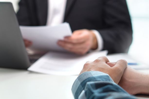 Business man or bank worker having discussion about loan or insurance.