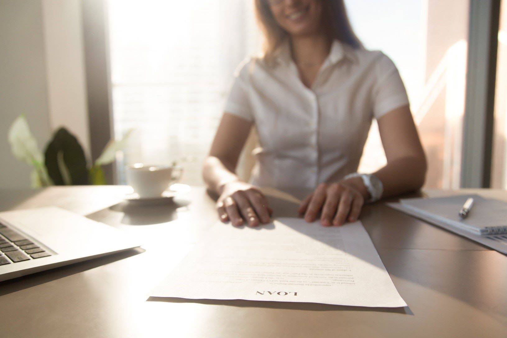 Woman works on her personal loan application