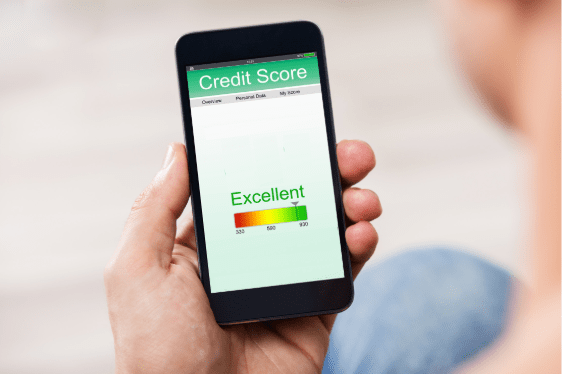 Man holding smart phone showing credit score on a screen