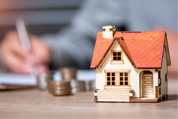 Lender signing the document to approve for a mortgage