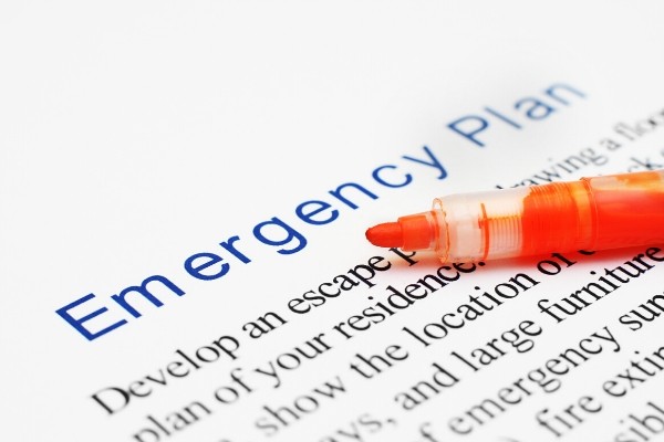 emergency plan documents and a marker