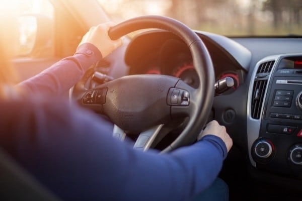 Close up of male hand starting car with key