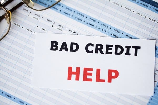 Words “bad credit help” written on white card