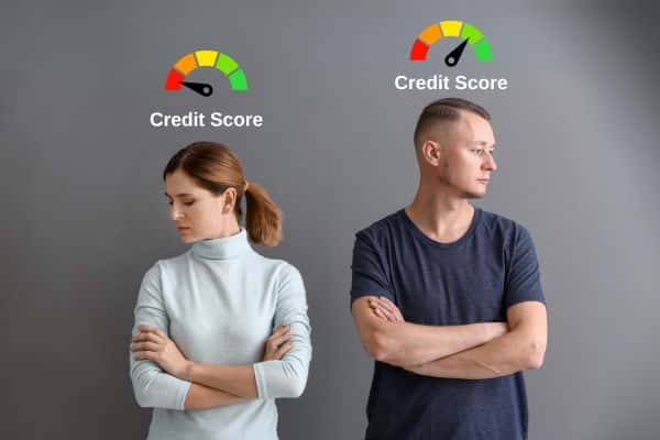Couple with good and bad credit score turning against each other.